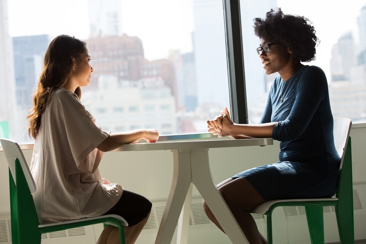 Two People In A Meeting to chat about transferable skills in career change